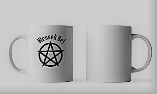 White mug with blessed be word in black text and pentacle graphic